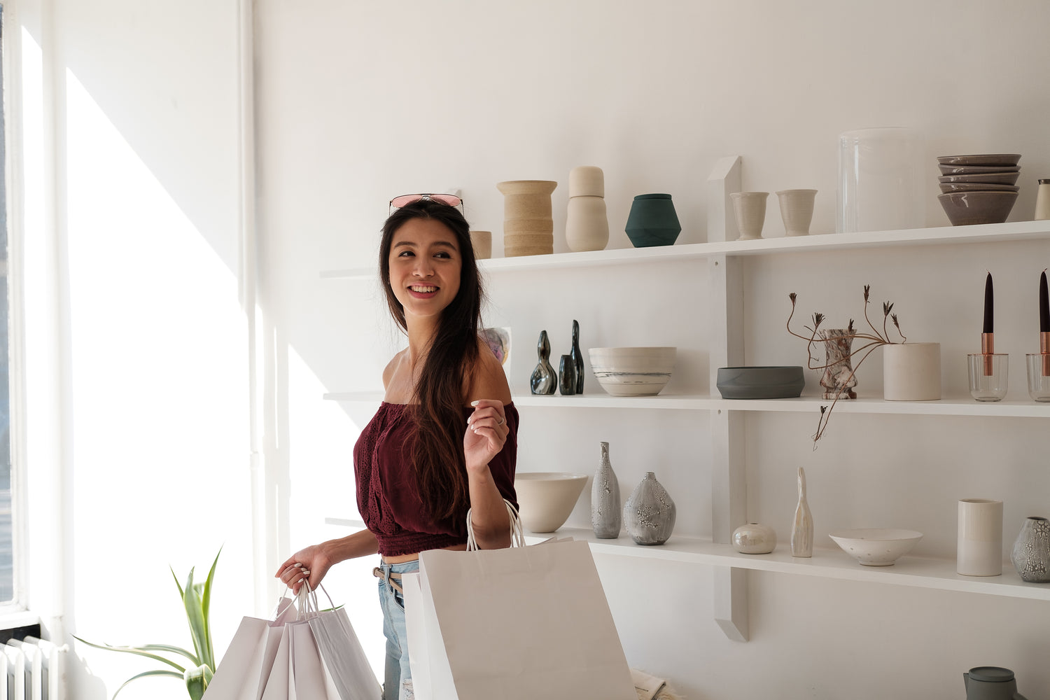 woman-with-white-crisp-shopping-carrier-bags